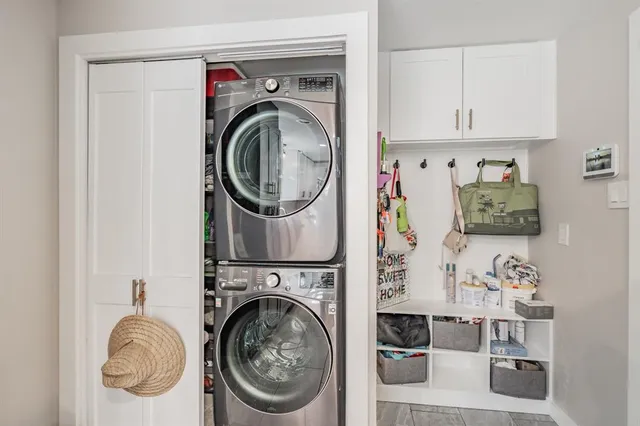 a view of a storage and utility room with washer and dryer