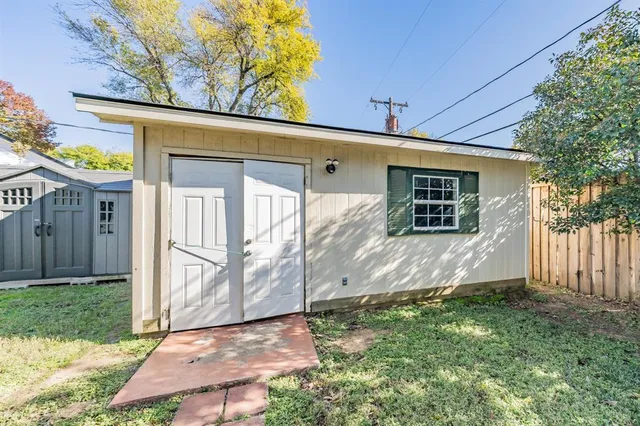 a view of a backyard with a small cabin