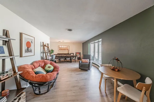 a living room with furniture and a rug