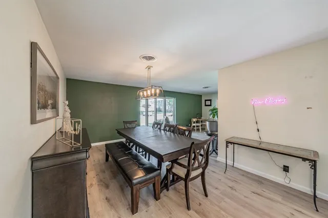 a view of a dining room with furniture and window