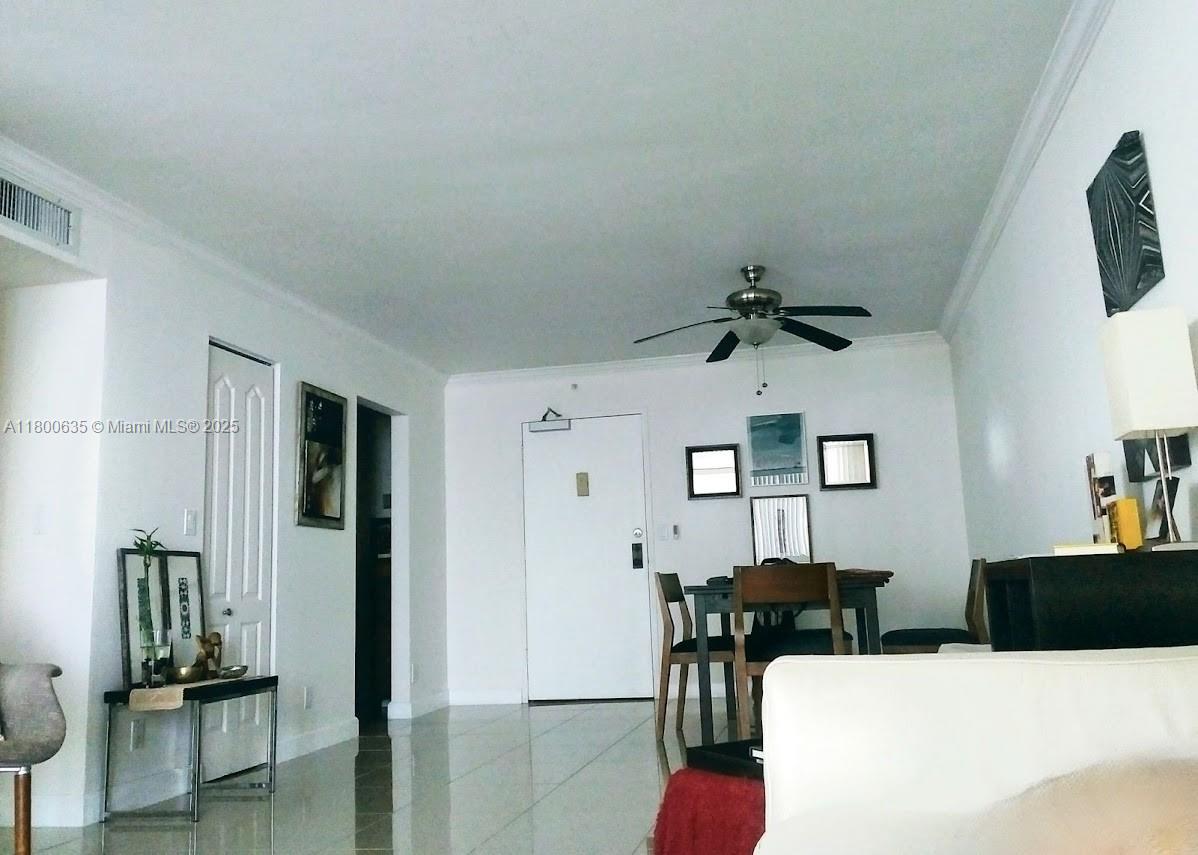 200 Southeast 15th Road, Unit 9B Miami, FL 33129 - Photo 14 of 39 a living room with furniture and a chandelier