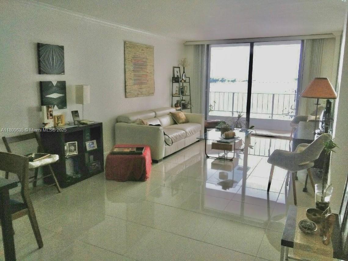 200 Southeast 15th Road, Unit 9B Miami, FL 33129 - Photo 16 of 39 a living room with furniture and a large window