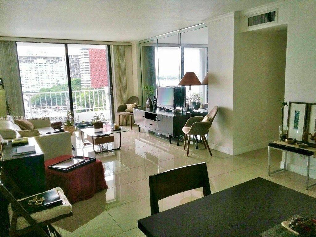 200 Southeast 15th Road, Unit 9B Miami, FL 33129 - Photo 17 of 39 a living room with furniture and large windows