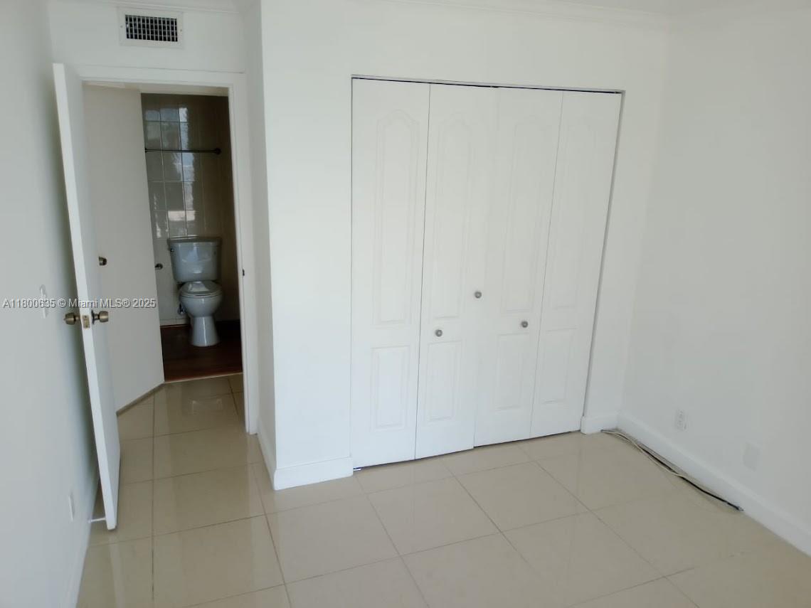 200 Southeast 15th Road, Unit 9B Miami, FL 33129 - Photo 24 of 39 an empty room and an entrance to other room