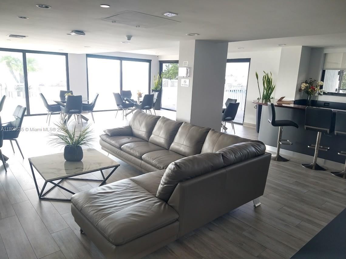 200 Southeast 15th Road, Unit 9B Miami, FL 33129 - Photo 27 of 39 a living room with furniture and a large window