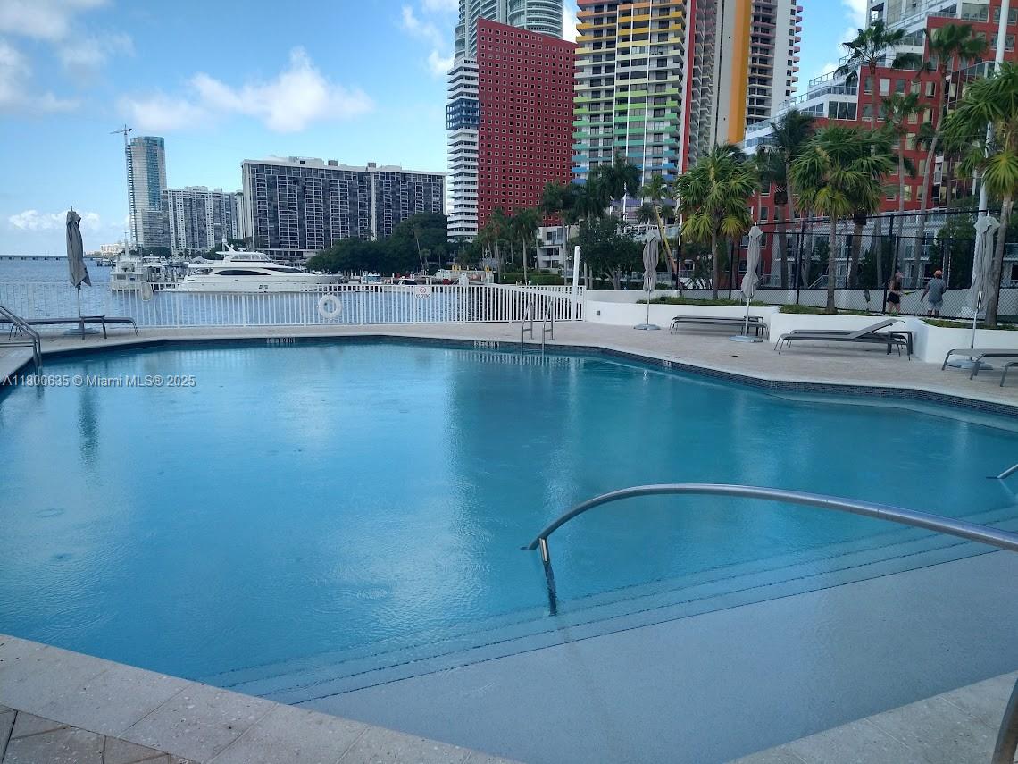 200 Southeast 15th Road, Unit 9B Miami, FL 33129 - Photo 30 of 39 a view of a swimming pool and a buildings
