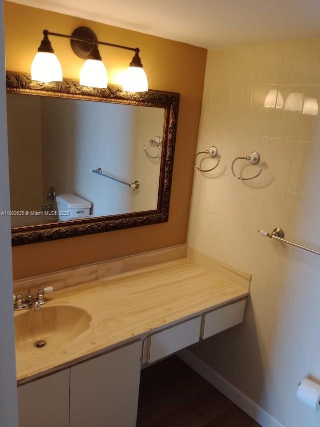 200 Southeast 15th Road, Unit 9B Miami, FL 33129 - Photo 5 of 39 a bathroom with a sink and mirror