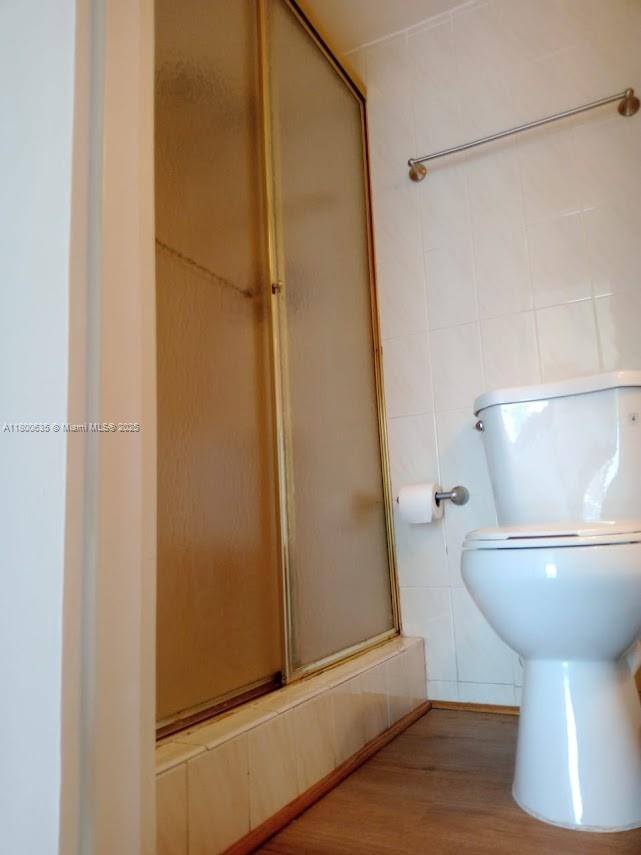 200 Southeast 15th Road, Unit 9B Miami, FL 33129 - Photo 6 of 39 a bathroom with a toilet and a shower