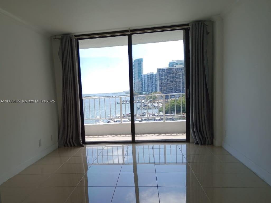 200 Southeast 15th Road, Unit 9B Miami, FL 33129 - Photo 8 of 39 a view of a glass door and the balcony