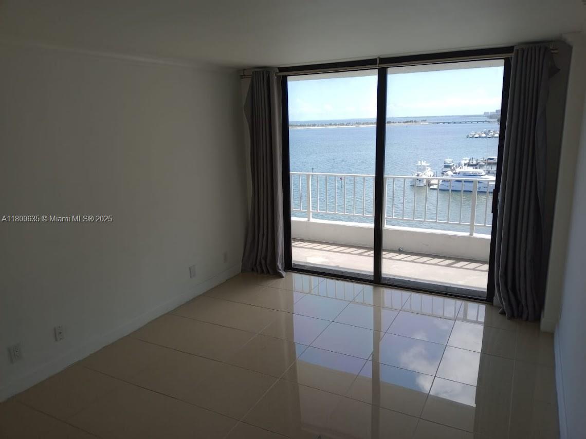 200 Southeast 15th Road, Unit 9B Miami, FL 33129 - Photo 9 of 39 a view of an empty room and window