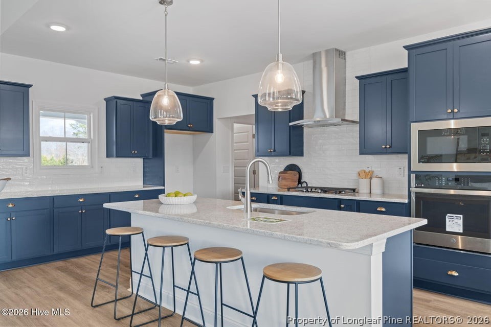 515 Sanctuary Trail Cameron, NC 28326 - Photo 24 of 46 a kitchen with granite countertop a sink cabinets and window