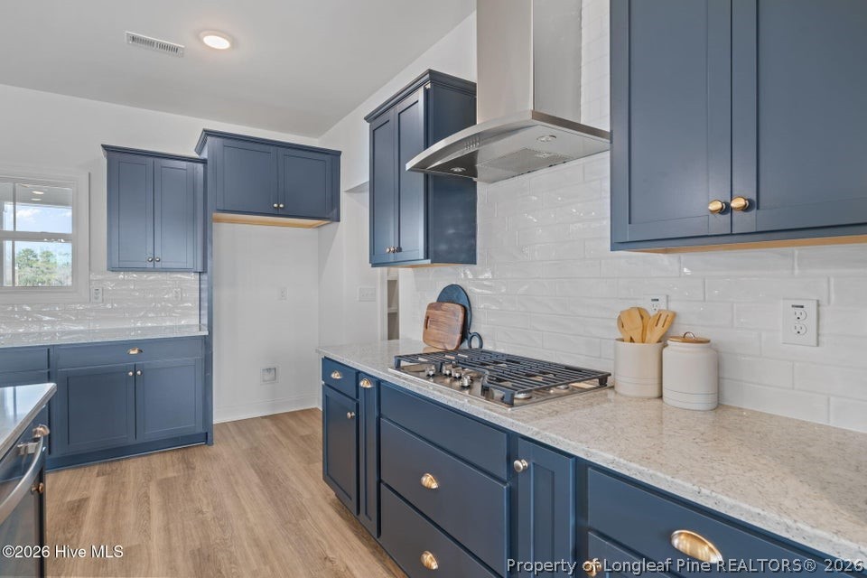 515 Sanctuary Trail Cameron, NC 28326 - Photo 26 of 46 a kitchen with stainless steel appliances granite countertop a sink stove and cabinets