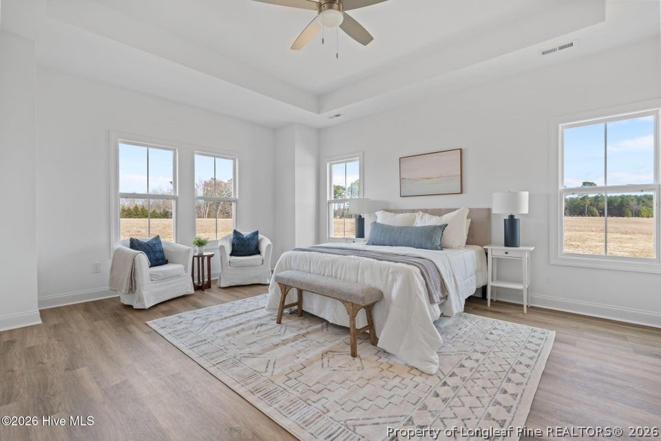 515 Sanctuary Trail Cameron, NC 28326 - Photo 28 of 46 a bedroom with a bed and a couch