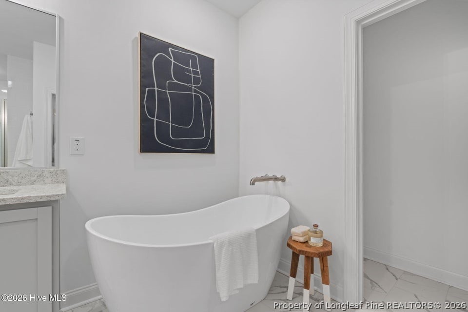 515 Sanctuary Trail Cameron, NC 28326 - Photo 31 of 46 a bathroom with a tub and a sink