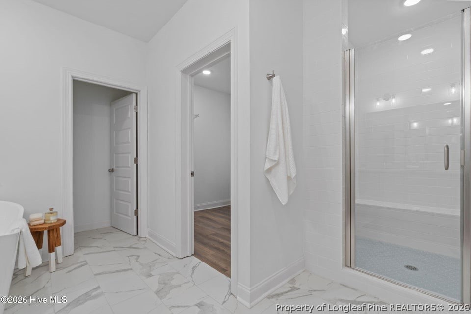 515 Sanctuary Trail Cameron, NC 28326 - Photo 32 of 46 a bathroom with a shower and a sink