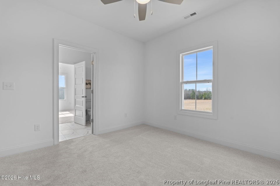 515 Sanctuary Trail Cameron, NC 28326 - Photo 41 of 46 an empty room with windows and entrance