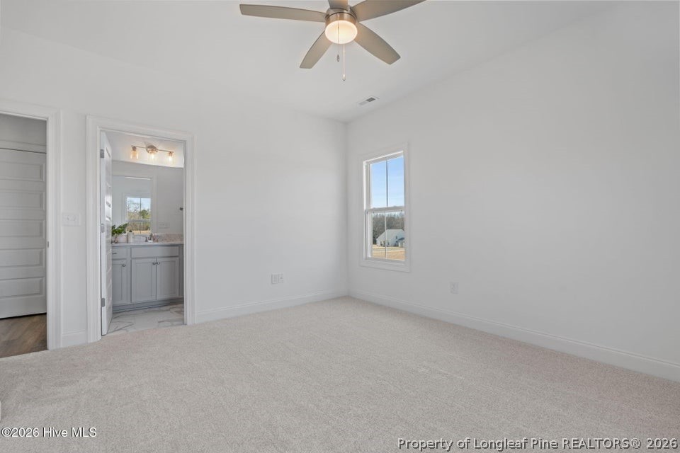 515 Sanctuary Trail Cameron, NC 28326 - Photo 42 of 46 a view of a room with a ceiling fan and a window