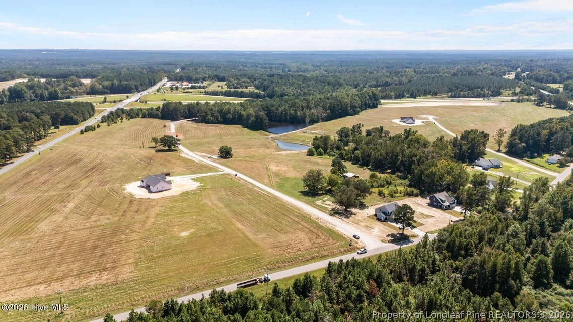 515 Sanctuary Trail Cameron, NC 28326 - Photo 4 of 46 an aerial view of residential houses with outdoor space