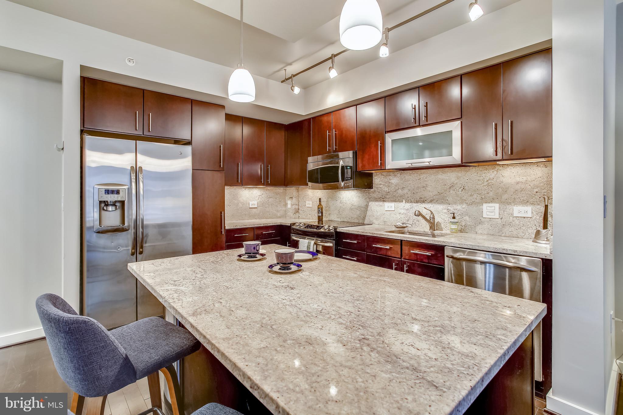 1025 First Street Southeast, Unit 901 Washington, DC 20003 - Photo 9 of 99 Kitchen-Featuring Center Island w/breakfast bar