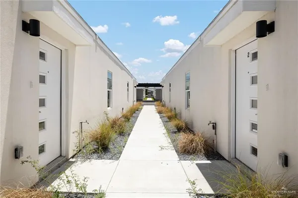 a view of a entrance to house with yard