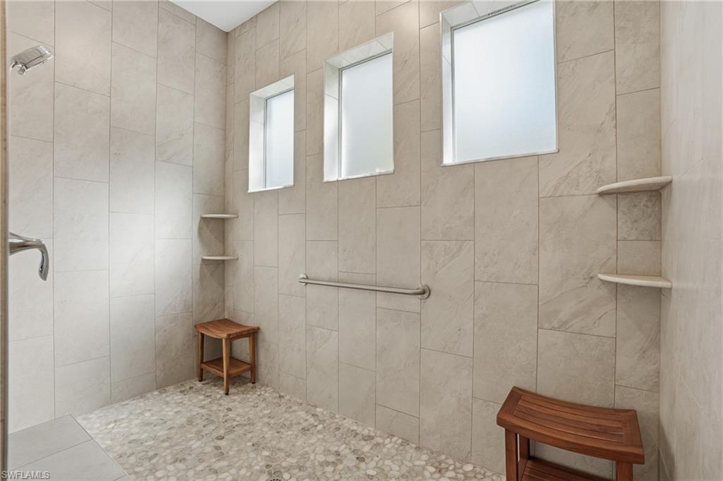 3707 5th Avenue Southwest Naples, FL 34117 - Photo 21 of 45 Full bathroom featuring a tile shower