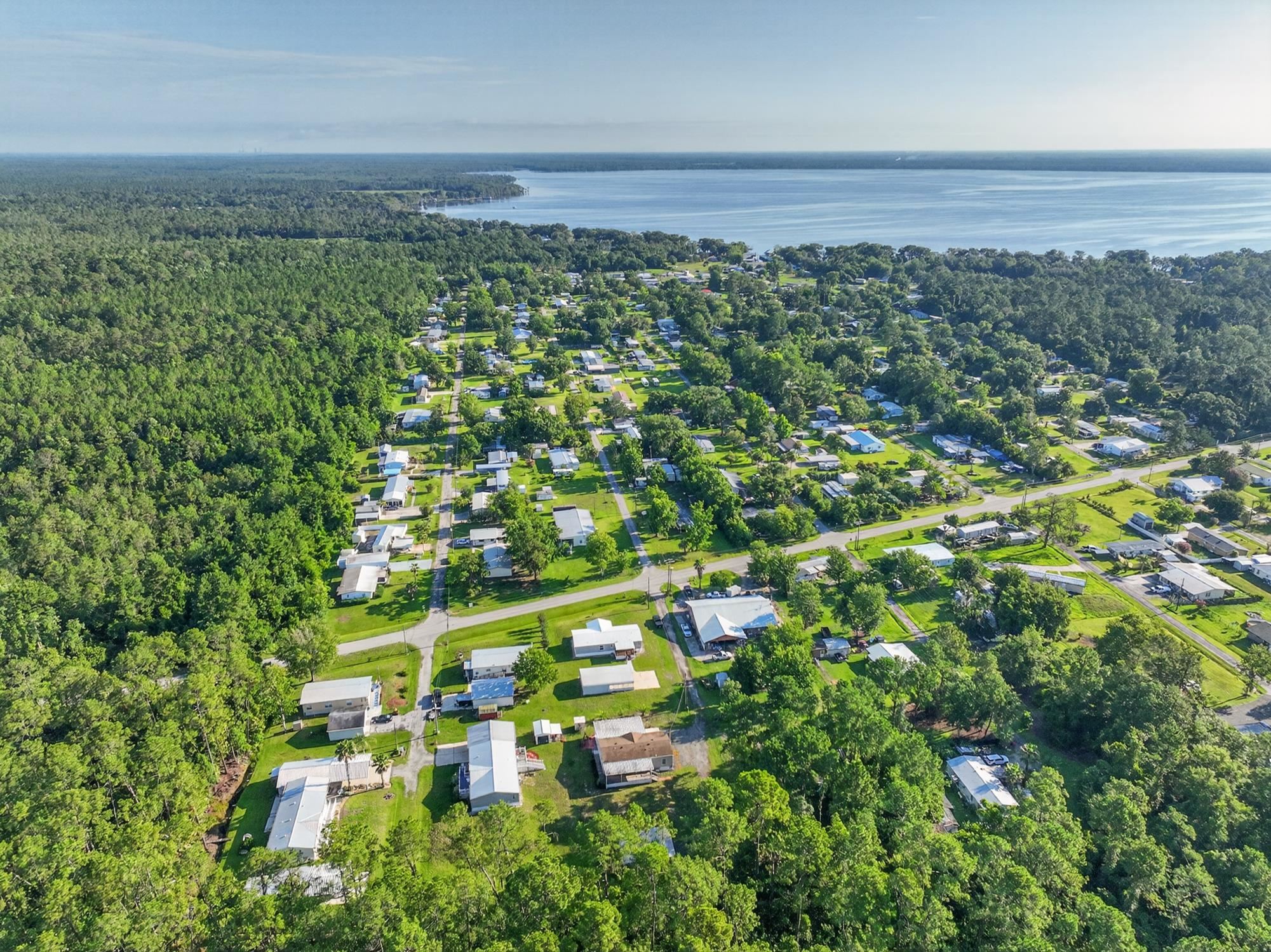 101 Trout Trail Crescent City, FL 32112 - Photo 27 of 45 a view of a city with lush green forest