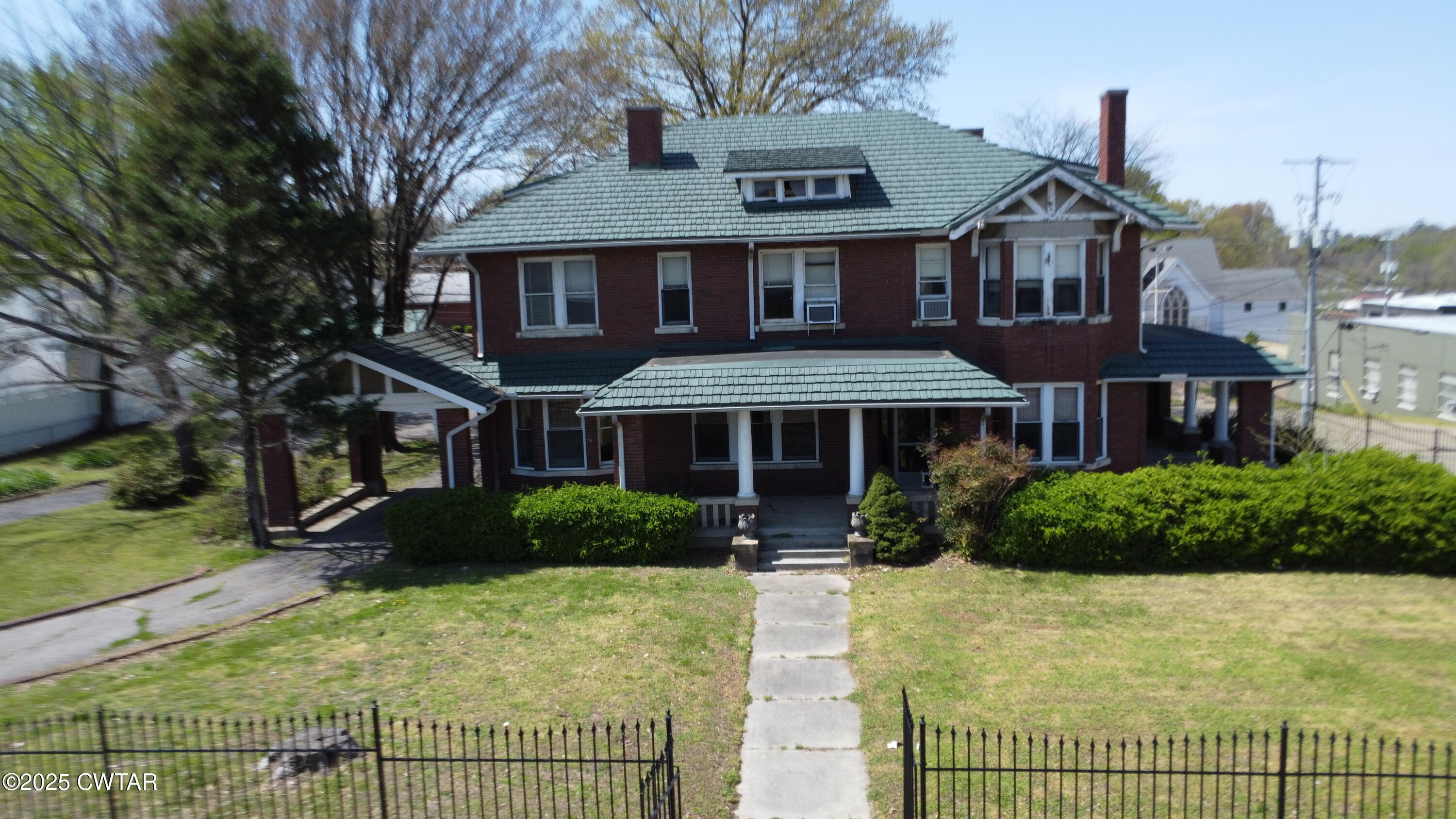 154 South Main Street Ripley, TN 38063 - Photo 1 of 40 a front view of a house with a yard
