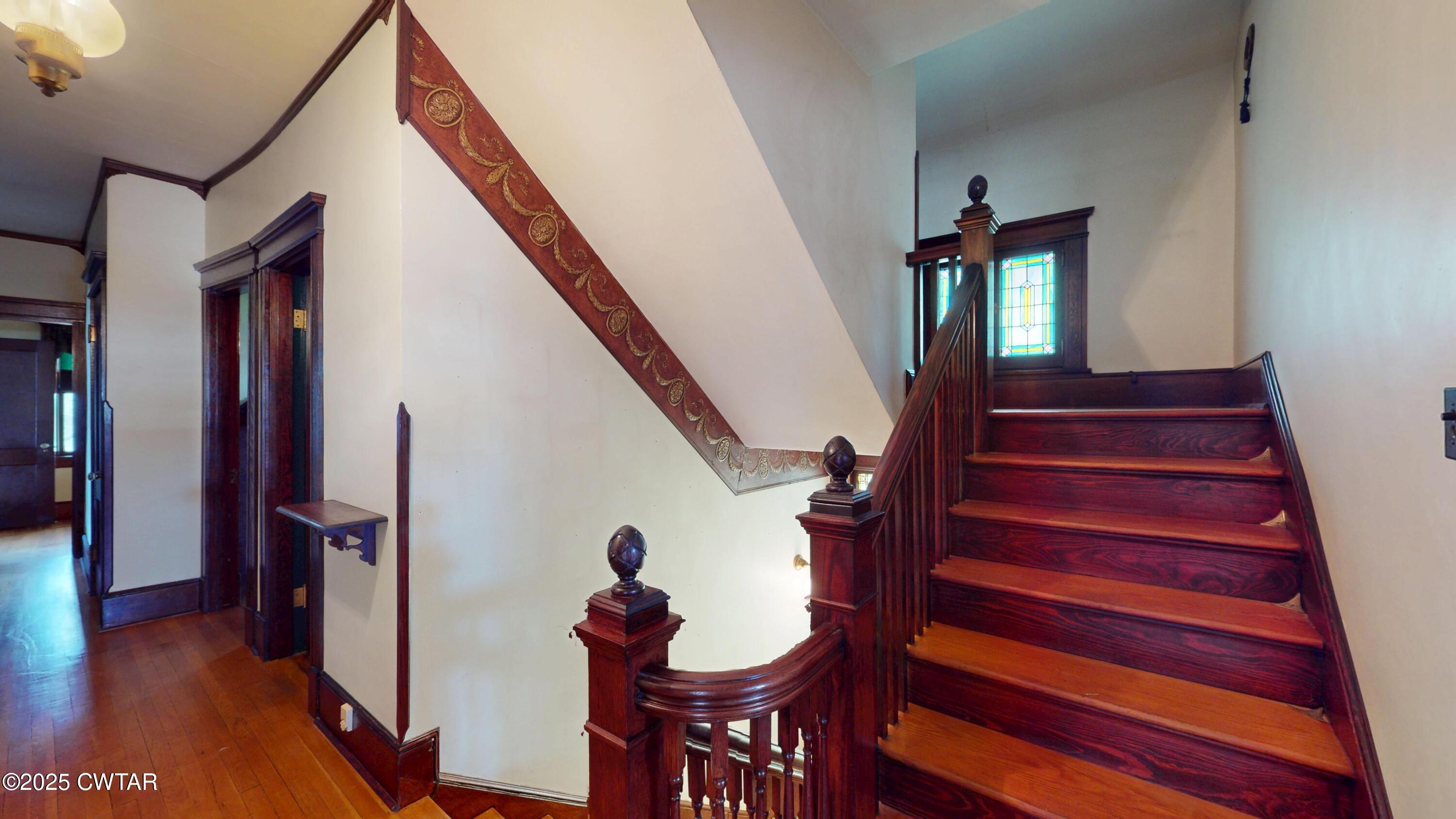 154 South Main Street Ripley, TN 38063 - Photo 18 of 40 a view of entryway with a front door and wooden floor