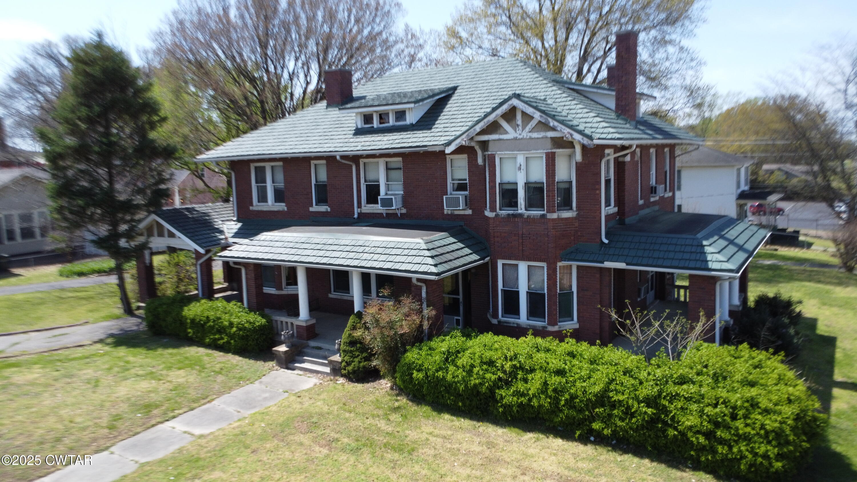 154 South Main Street Ripley, TN 38063 - Photo 2 of 40 a front view of a house with garden