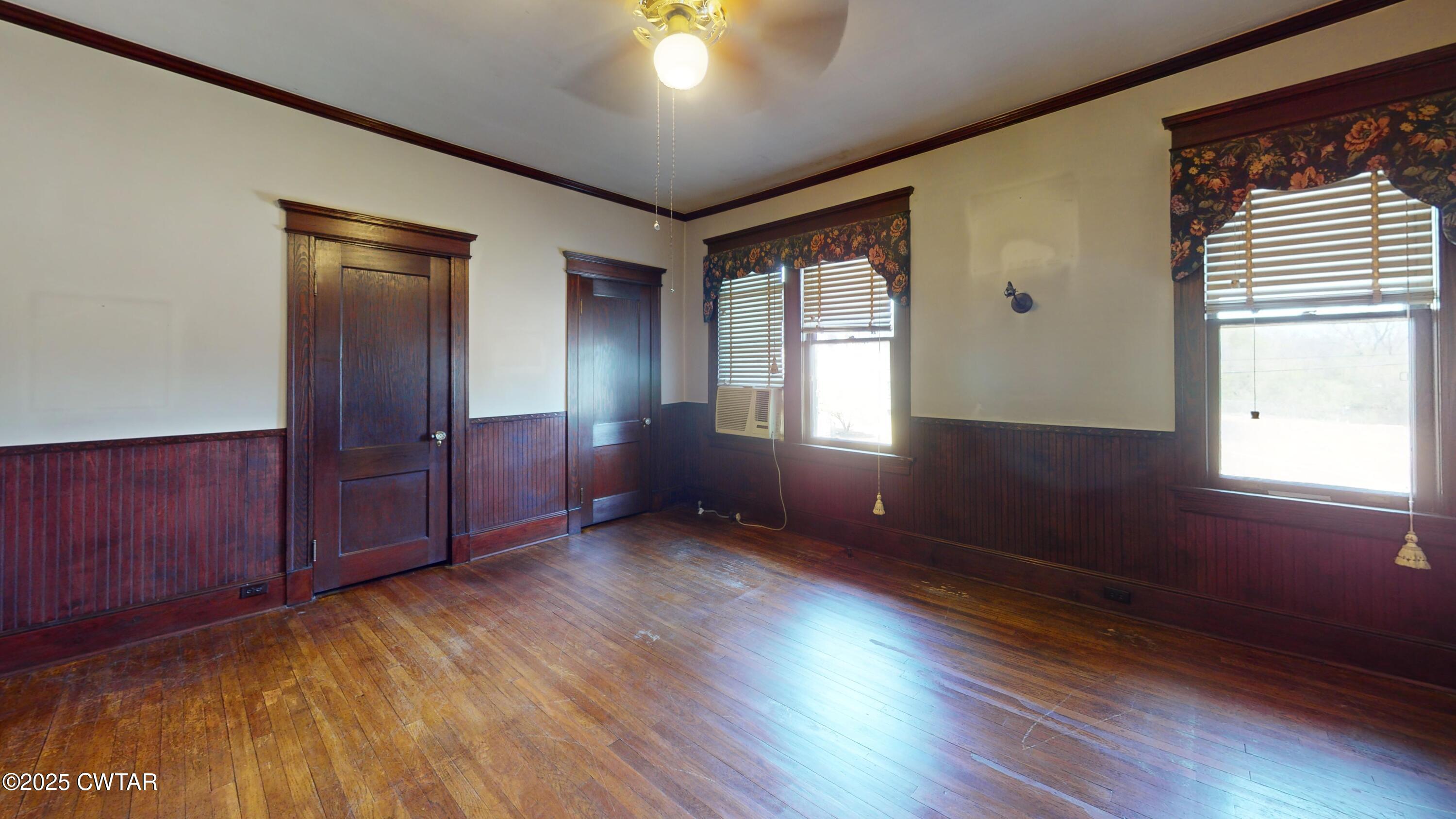 154 South Main Street Ripley, TN 38063 - Photo 22 of 40 wooden floor in an empty room with a window