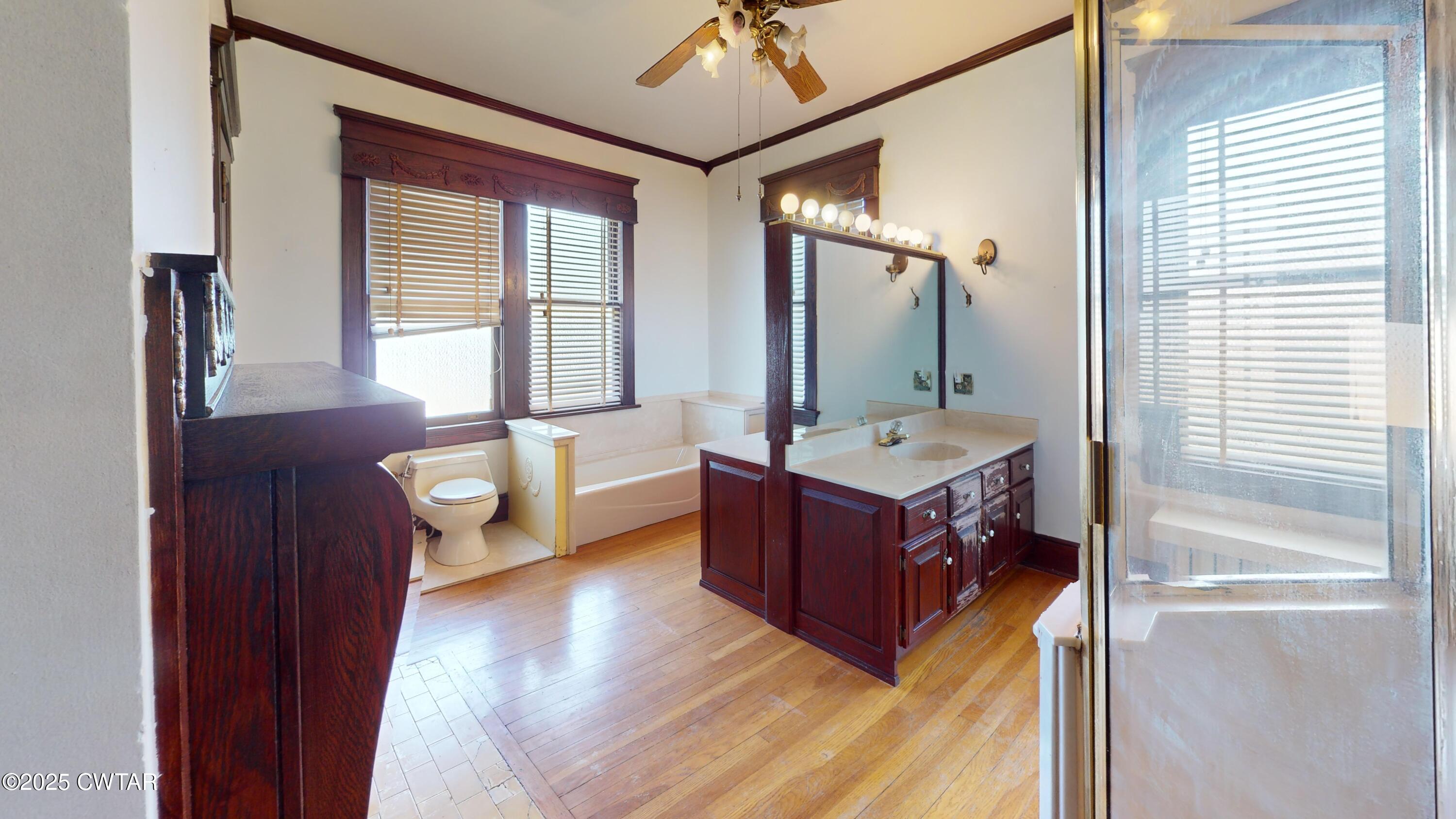154 South Main Street Ripley, TN 38063 - Photo 25 of 40 a spacious bathroom with a tub shower and mirror