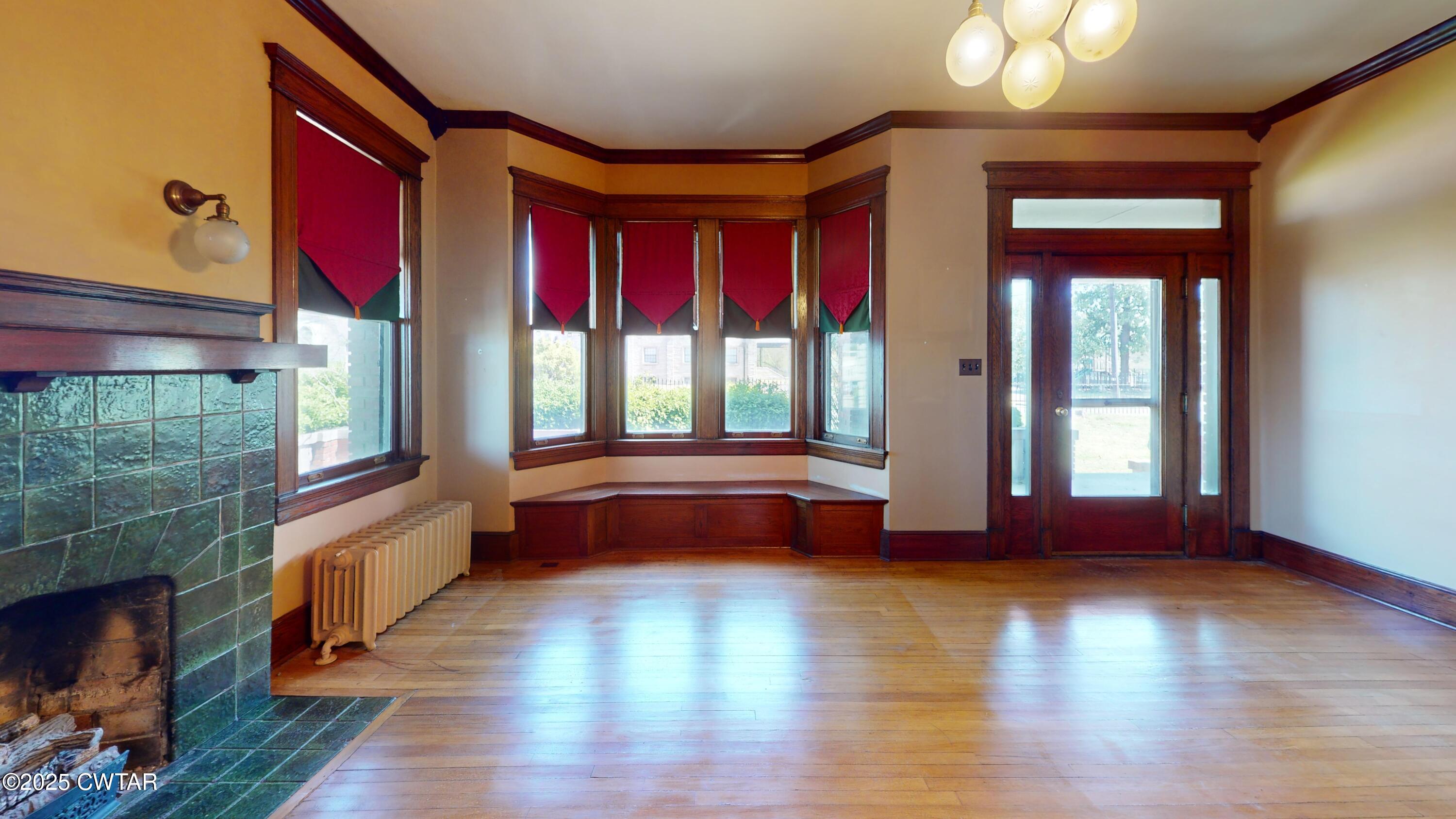 154 South Main Street Ripley, TN 38063 - Photo 5 of 40 a view of front door with hallway and wooden floor