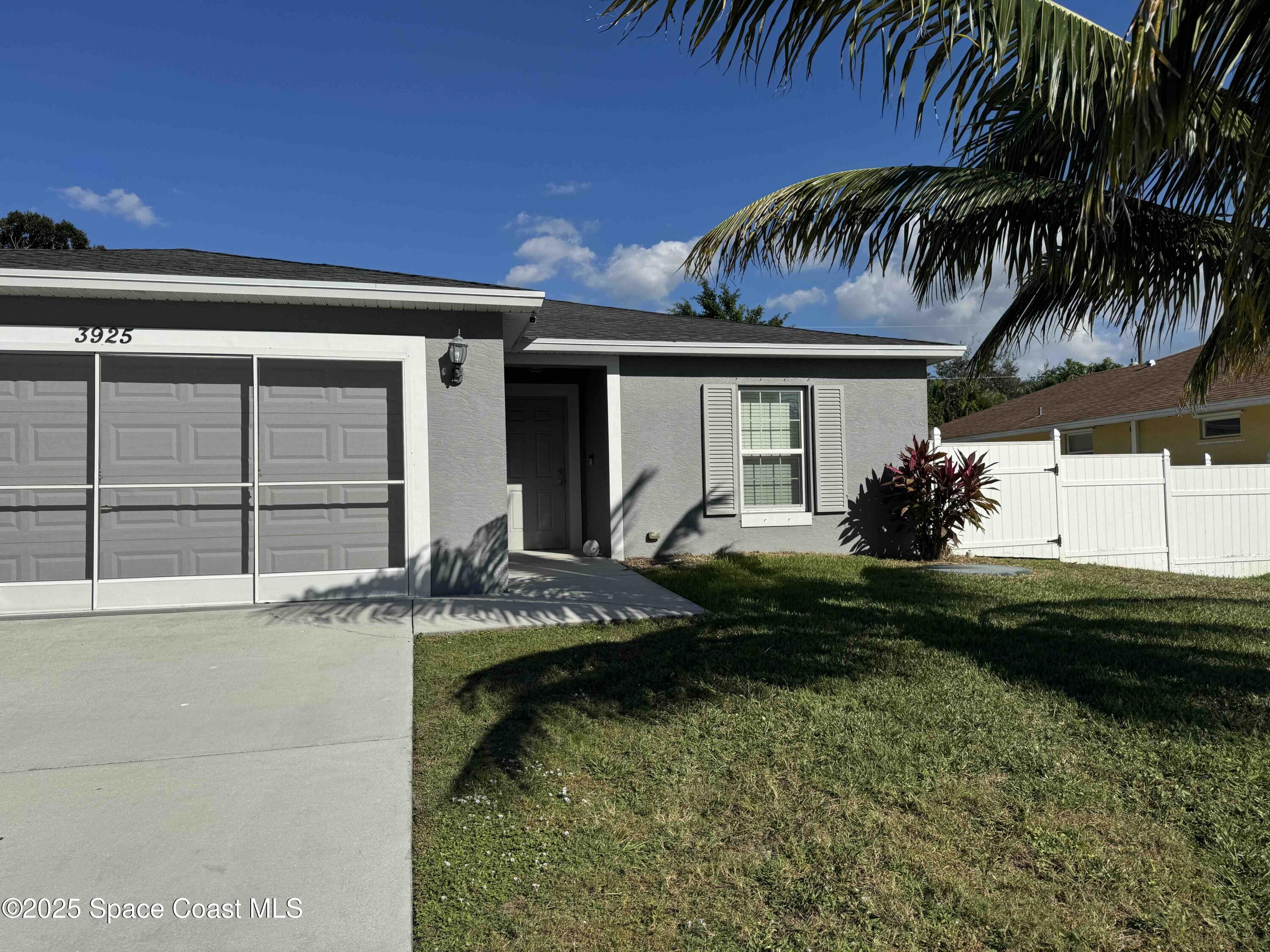 3925 Southwest Laffite Street Port St. Lucie, FL 34953 - Photo 2 of 20 a front view of house with yard