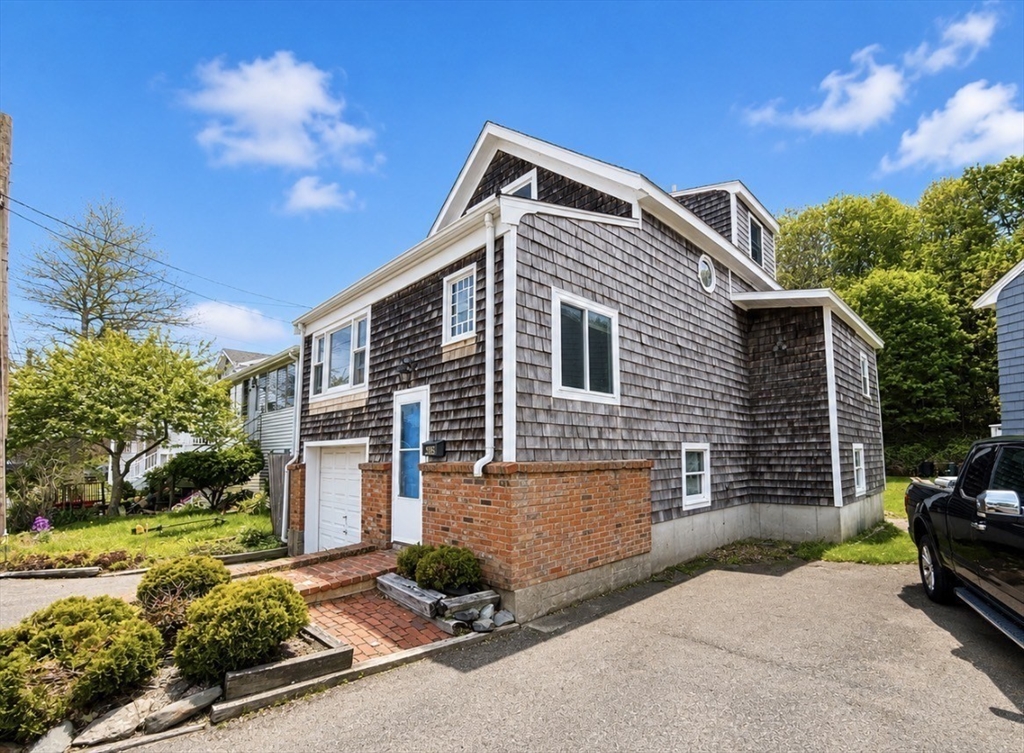 439 Newport Road Hull, MA 02045 - Photo 2 of 19 a view of a house with a yard
