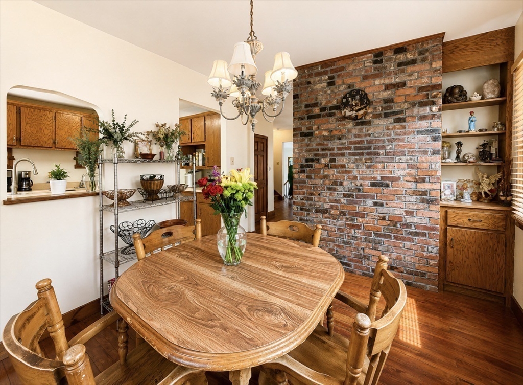 439 Newport Road Hull, MA 02045 - Photo 4 of 19 a dining room with furniture and wooden floor