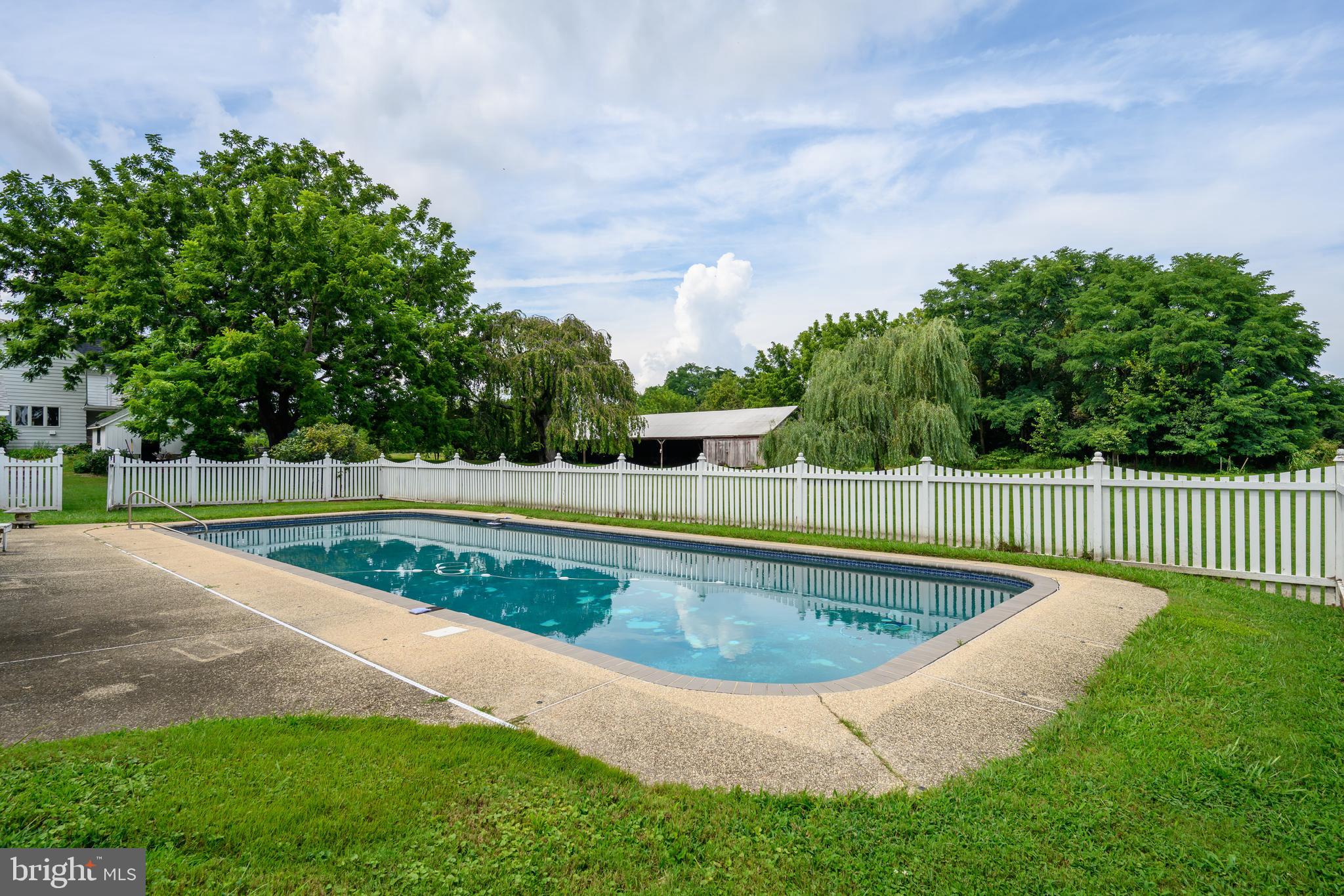 13699 Still Pond Road Still Pond, MD 21667 - Photo 18 of 55 a view of a swimming pool with a garden