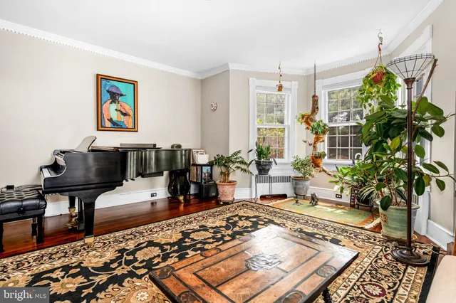 a living room with furniture and a rug