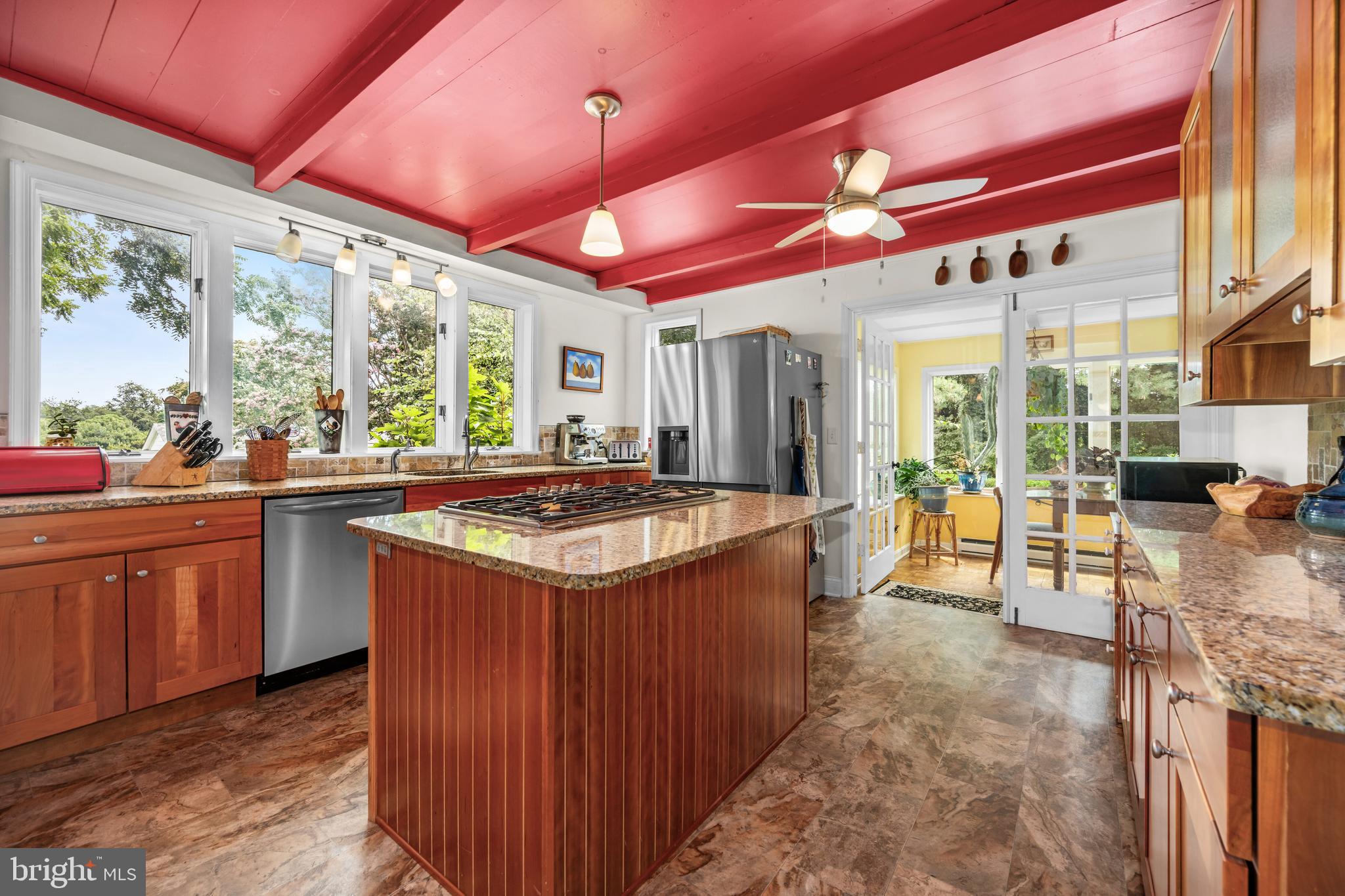 13699 Still Pond Road Still Pond, MD 21667 - Photo 29 of 55 a kitchen with stainless steel appliances granite countertop a sink and wooden cabinets