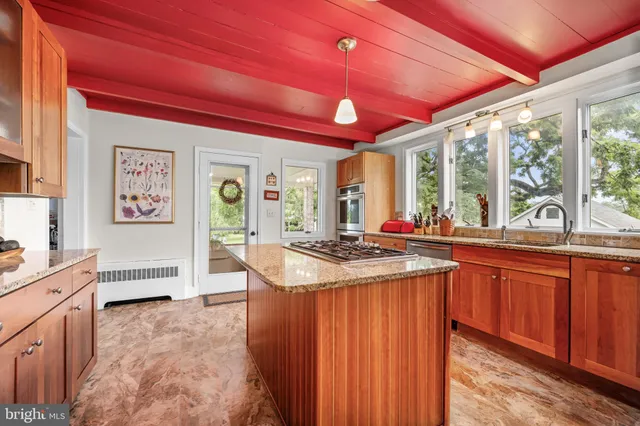 a view of a livingroom with furniture and a table