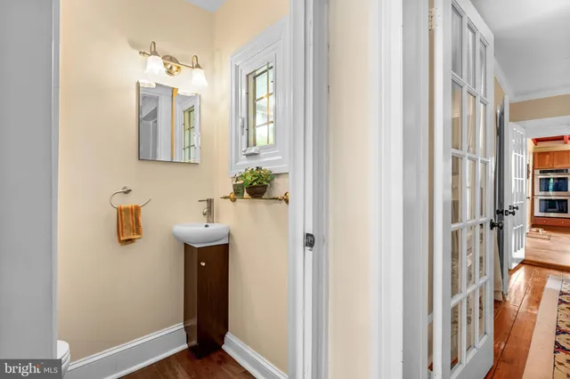 a view of an entryway with wooden floor and stairs