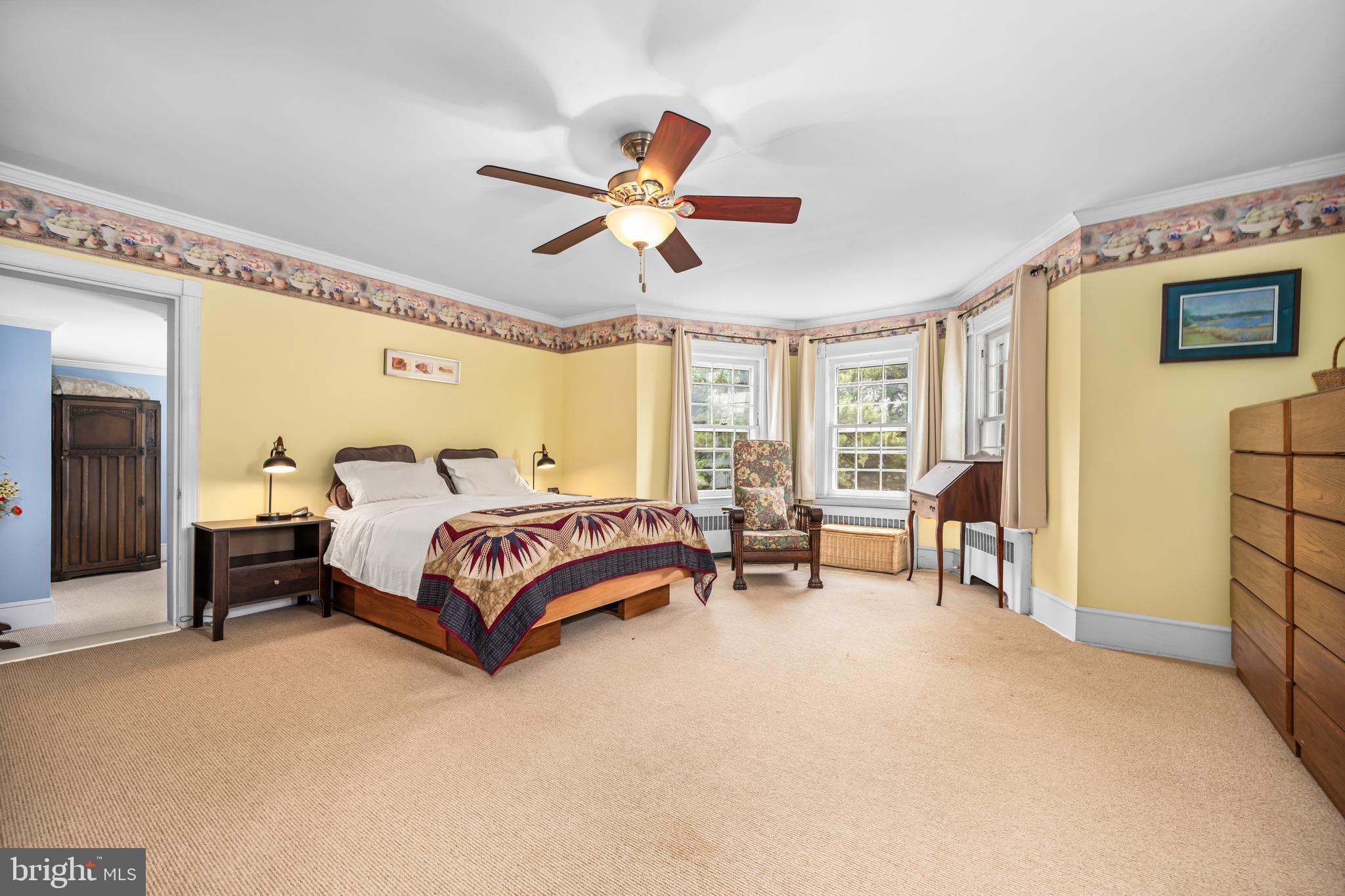 13699 Still Pond Road Still Pond, MD 21667 - Photo 38 of 55 a bedroom with a bed and a chandelier