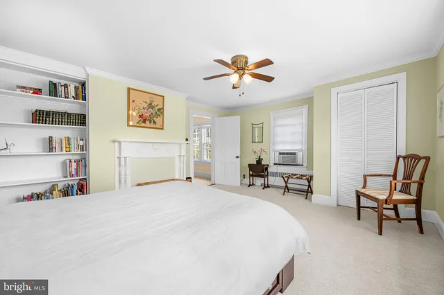 a bathroom with a granite countertop sink a mirror and a window