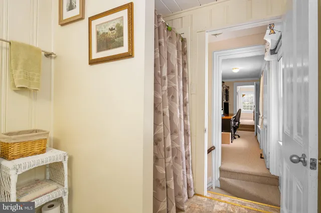 a spacious bedroom with a bed and a cabinets