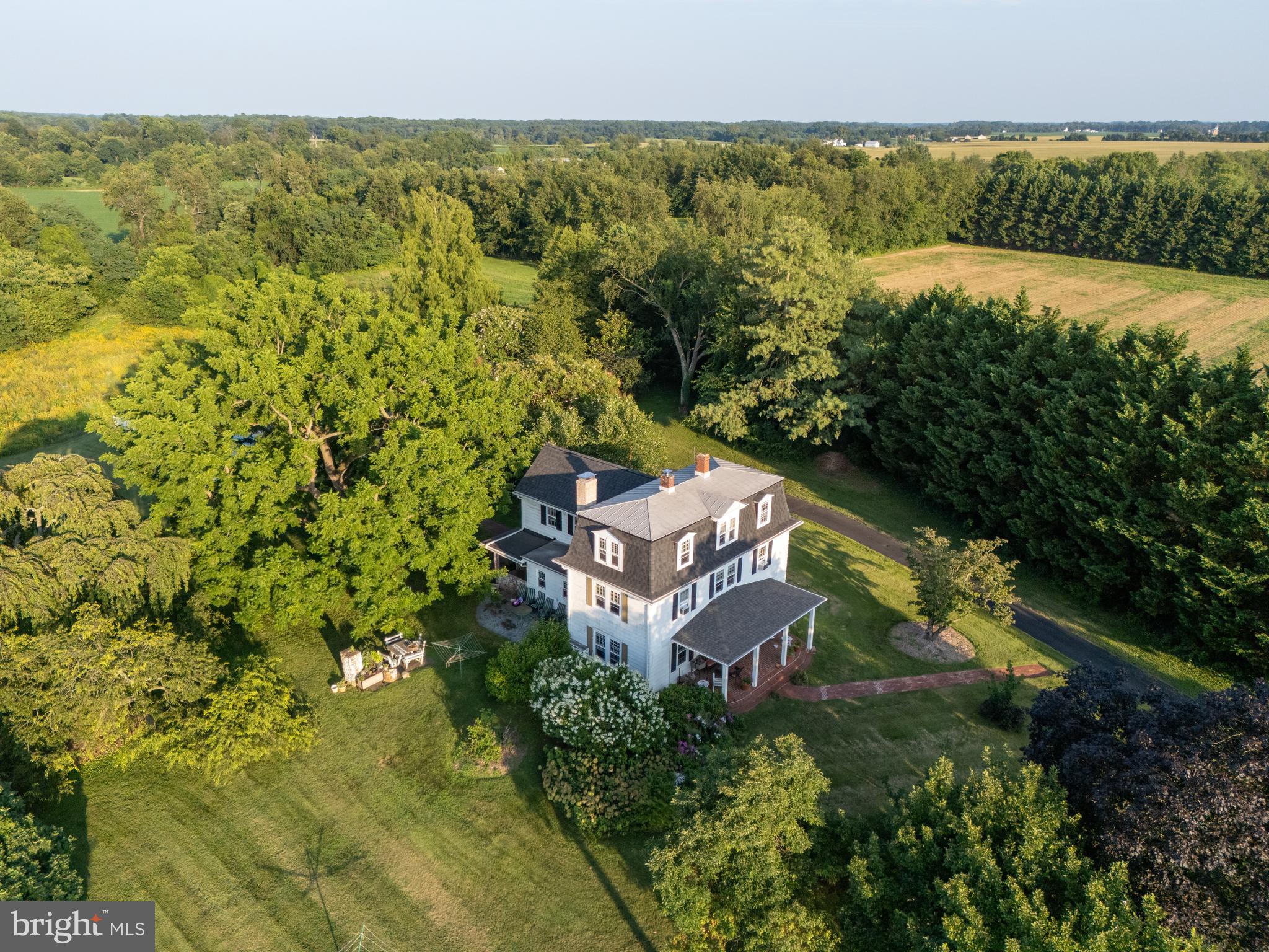 13699 Still Pond Road Still Pond, MD 21667 - Photo 5 of 55 a view of a lake with a building in the background