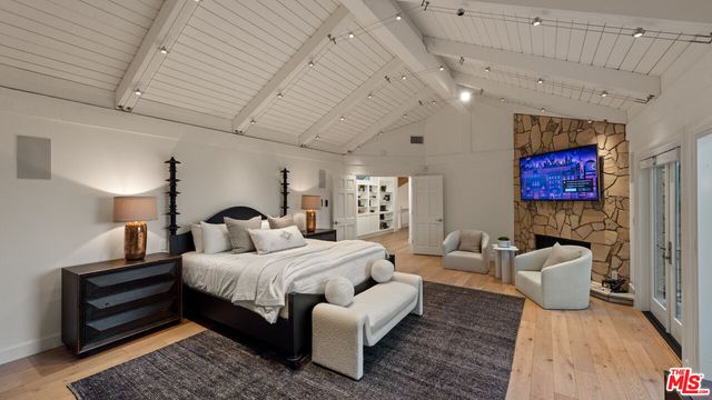 a bathroom with a granite countertop tub and a sink