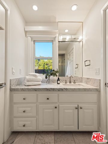 a view of a backyard with plants and lake view