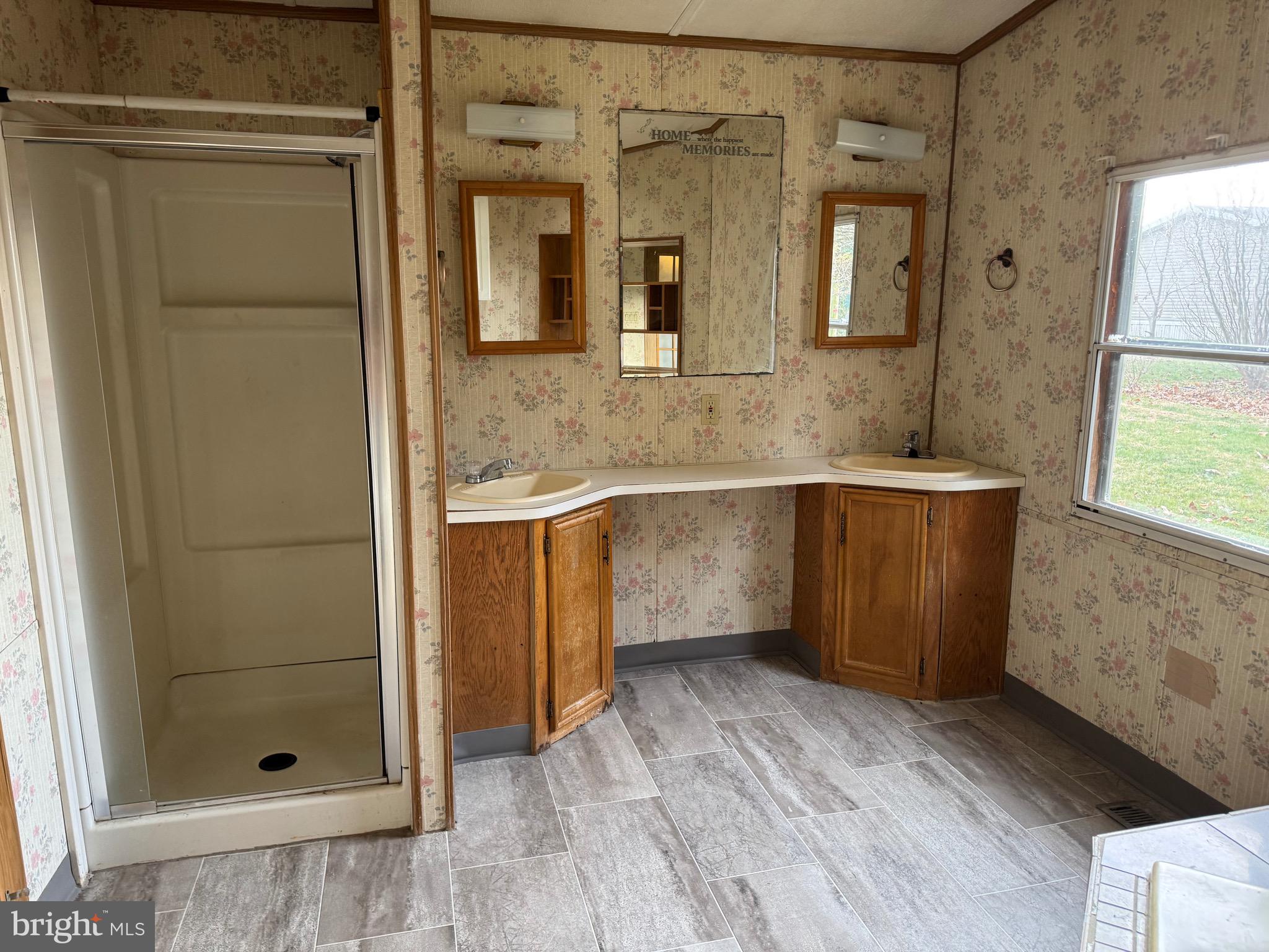25 Hopkins Mill Road, Unit 23 New Providence, PA 17560 - Photo 5 of 13 a bathroom with a sink and shower