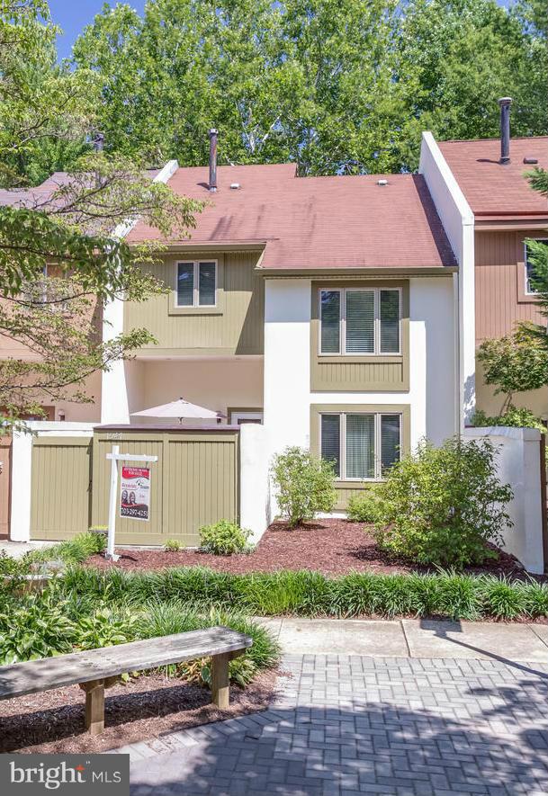 1547 Inlet Court Reston, VA 20190 - Photo 1 of 30 a front view of a house with a garden and plants