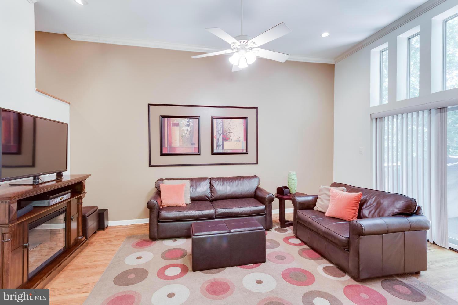 1547 Inlet Court Reston, VA 20190 - Photo 13 of 30 a living room with furniture and a flat screen tv