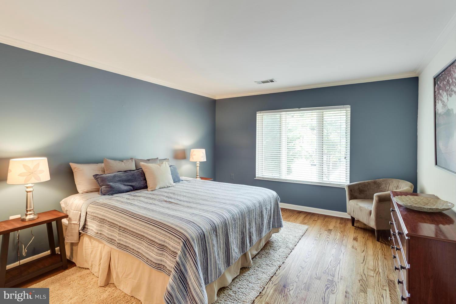1547 Inlet Court Reston, VA 20190 - Photo 16 of 30 a bedroom with a bed and a window